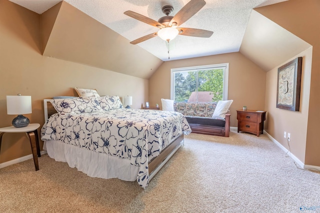 carpeted bedroom featuring baseboards, a ceiling fan, and vaulted ceiling