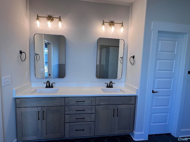 bathroom featuring tile patterned flooring and vanity