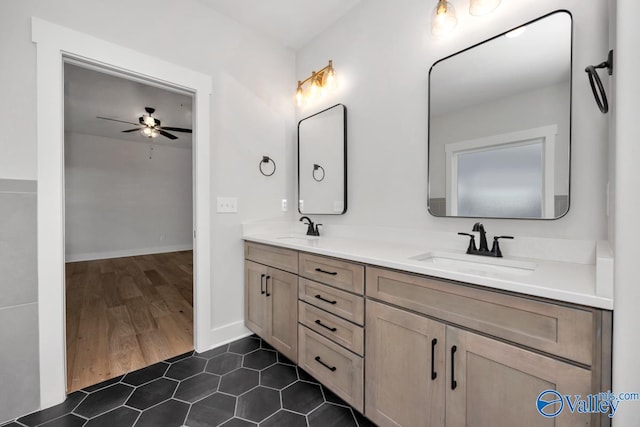 bathroom with vanity, hardwood / wood-style floors, and ceiling fan