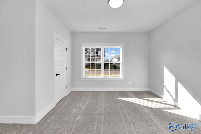 spare room with carpet flooring