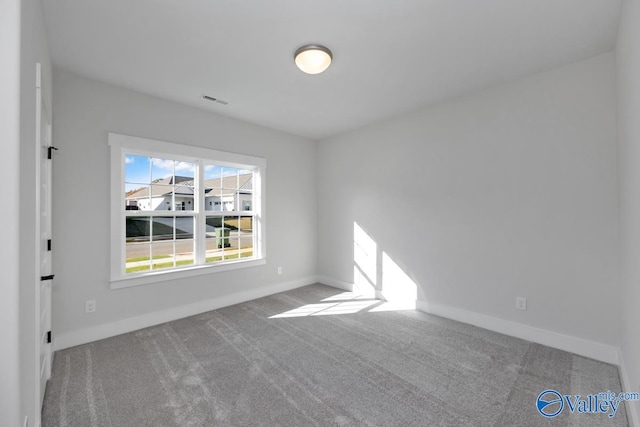 unfurnished room with carpet floors