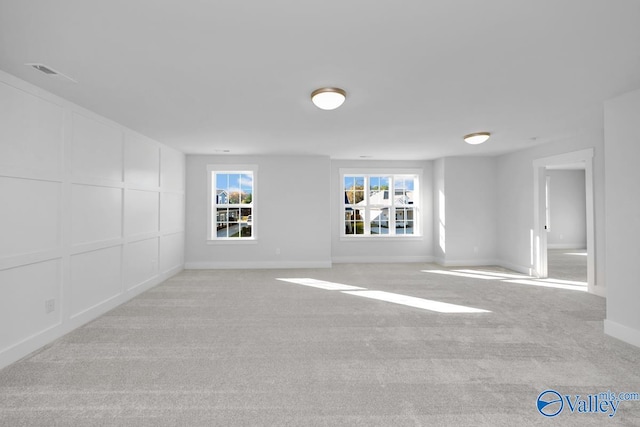 spare room with light carpet