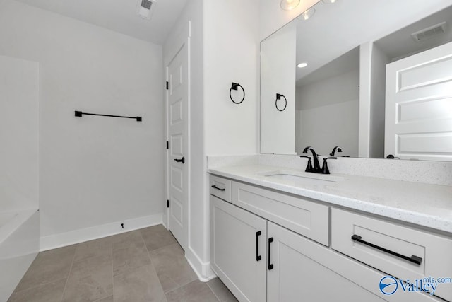 bathroom with tile patterned flooring and vanity