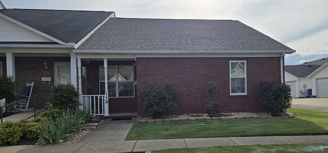 113 Sycamore Pl, Athens, AL 35611 - view of front facade featuring brick siding, roof with shingles, and a garage