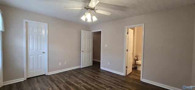 113 Sycamore Pl, Athens, AL 35611 - unfurnished bedroom featuring dark wood-style flooring, baseboards, ensuite bathroom, and a ceiling fan