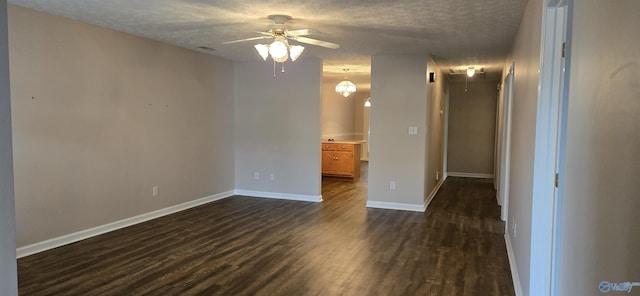 113 Sycamore Pl, Athens, AL 35611 - spare room featuring attic access, a ceiling fan, dark wood-style flooring, a textured ceiling, and baseboards