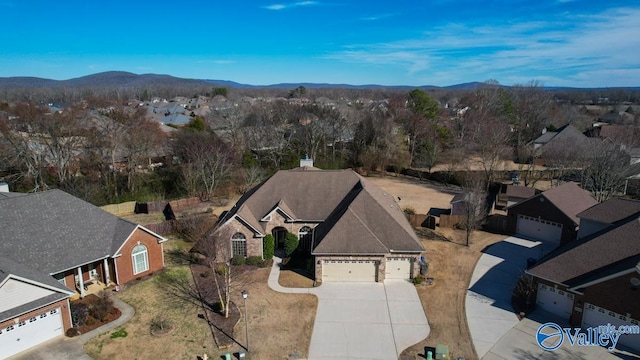 bird's eye view featuring a residential view and a mountain view