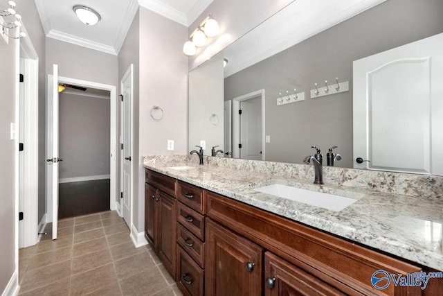 bathroom with double vanity, tile patterned flooring, ornamental molding, and a sink