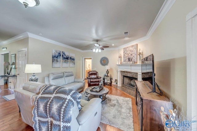 990 Chambers Rd, Double Springs, AL 35553 - living area with wood finished floors, ceiling fan, a fireplace, and crown molding