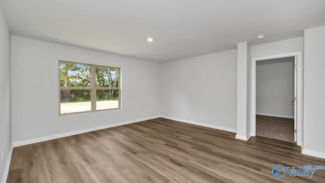 spare room with hardwood / wood-style floors