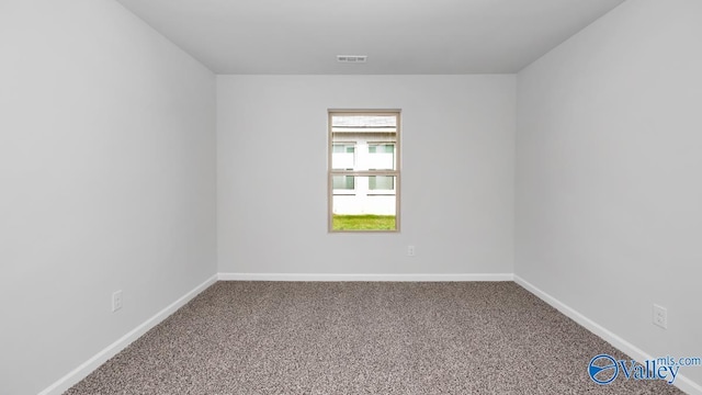 empty room featuring carpet flooring