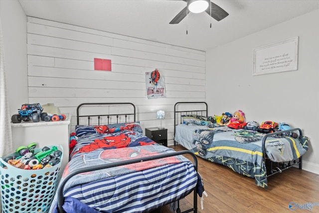 bedroom with ceiling fan and hardwood / wood-style floors