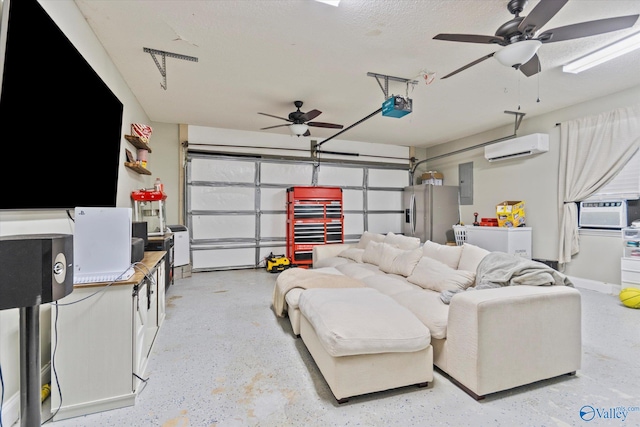 garage featuring a wall mounted air conditioner, electric panel, a garage door opener, ceiling fan, and stainless steel fridge