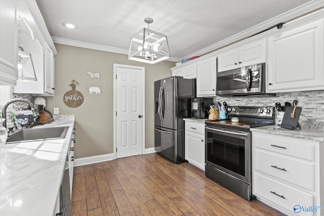 kitchen featuring white cabinetry, sink, stainless steel appliances, and dark hardwood / wood-style floors