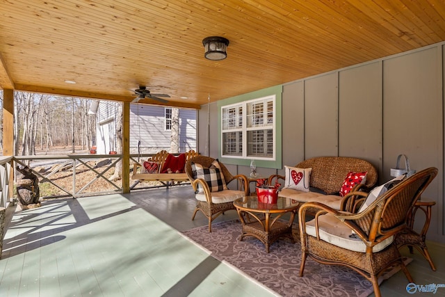 sunroom / solarium with wood ceiling and ceiling fan