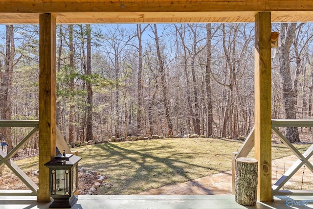 view of yard with a view of trees