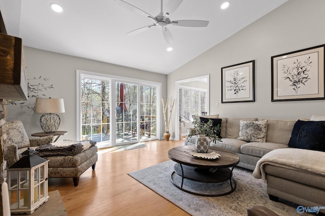 living room with vaulted ceiling, ceiling fan, light wood finished floors, and recessed lighting