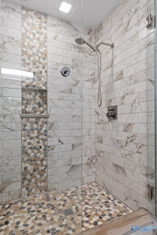 full bathroom featuring a stall shower