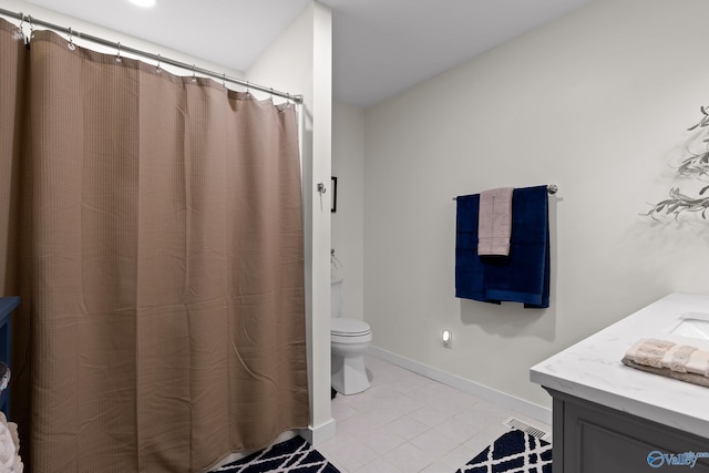 full bath with toilet, tile patterned floors, vanity, and baseboards