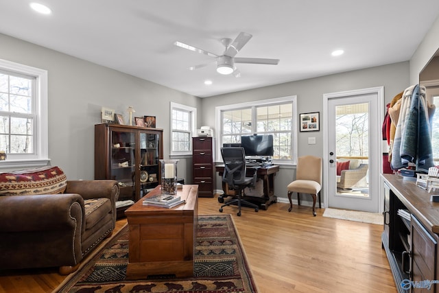 home office featuring light wood-type flooring, ceiling fan, baseboards, and recessed lighting