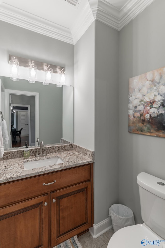 bathroom with crown molding, tile patterned flooring, vanity, and toilet