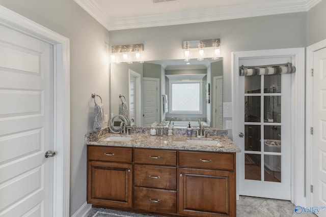 bathroom with vanity and ornamental molding