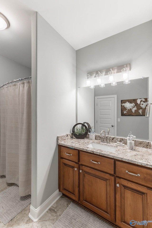 bathroom featuring tile patterned flooring and vanity