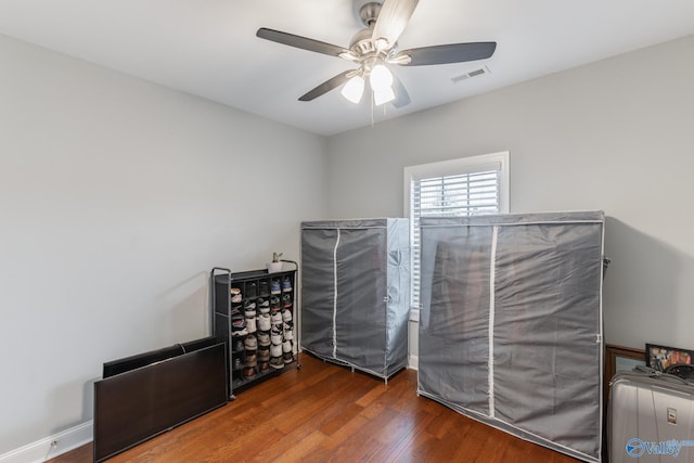 unfurnished bedroom with dark hardwood / wood-style flooring and ceiling fan