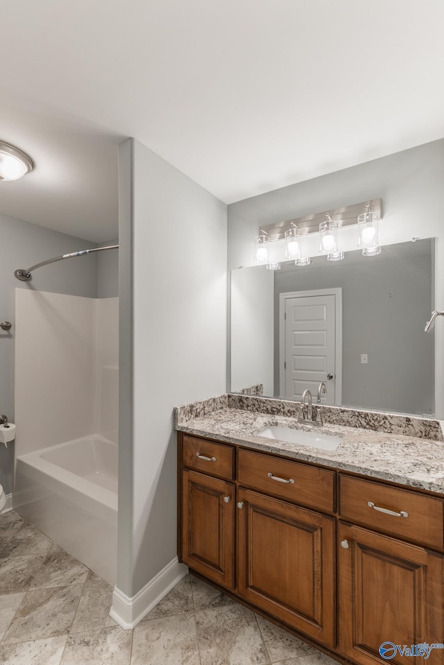 bathroom with bathtub / shower combination and vanity