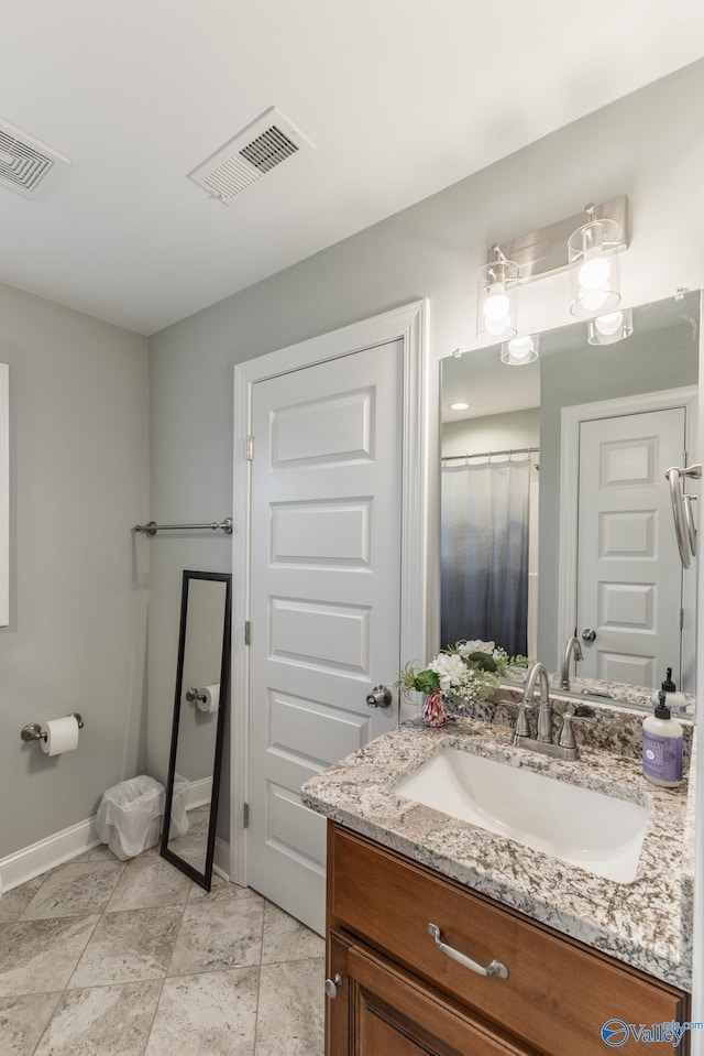 bathroom with vanity and tile patterned floors