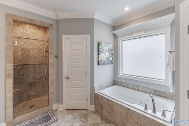 bathroom with ornamental molding and shower with separate bathtub