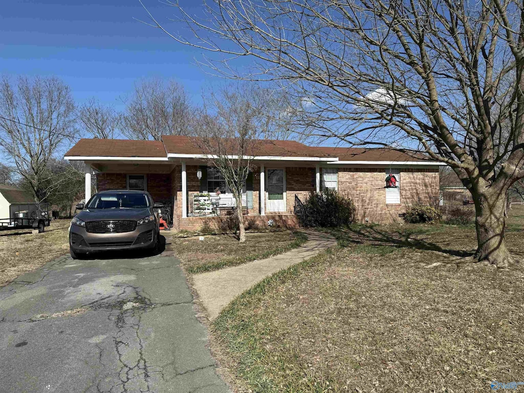 ranch-style home with a carport