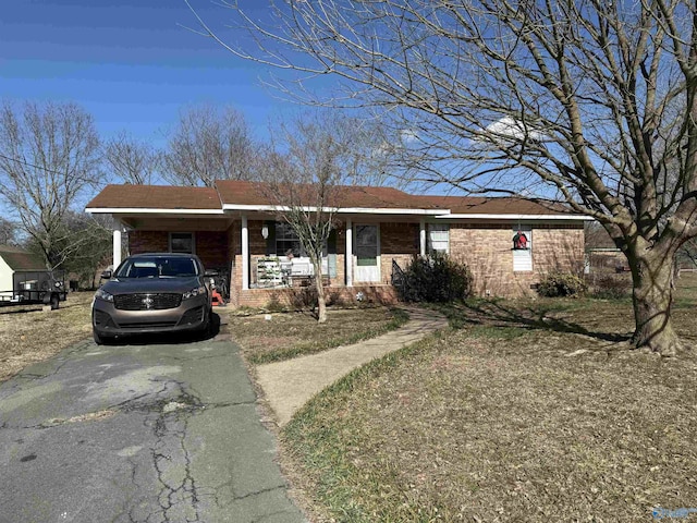 single story home with a carport