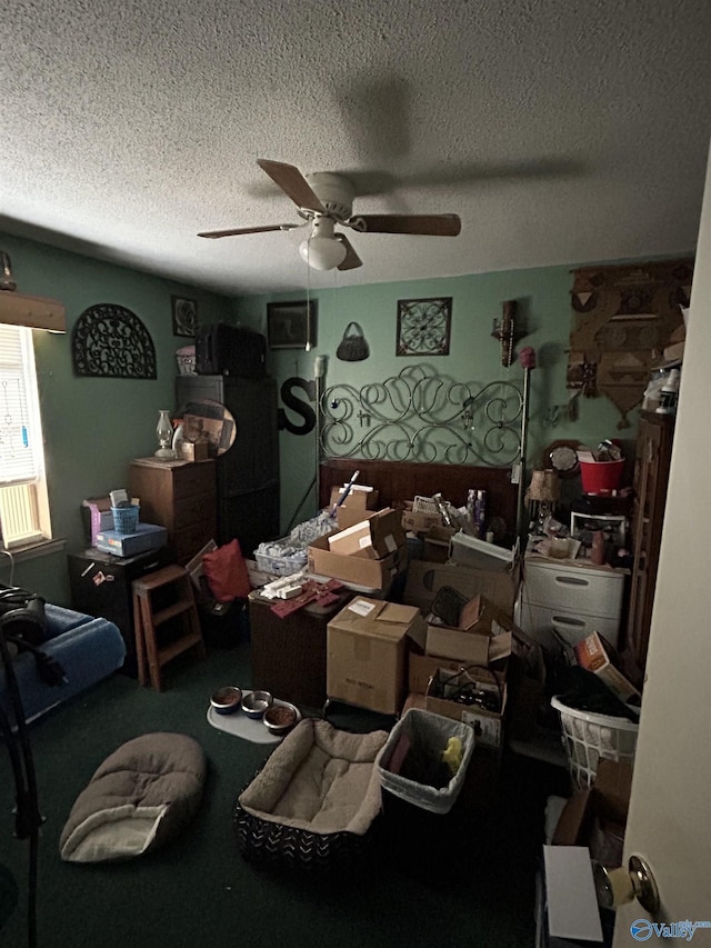 misc room featuring carpet, a textured ceiling, and ceiling fan