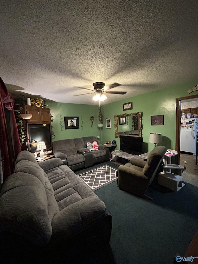 living room featuring a textured ceiling and ceiling fan
