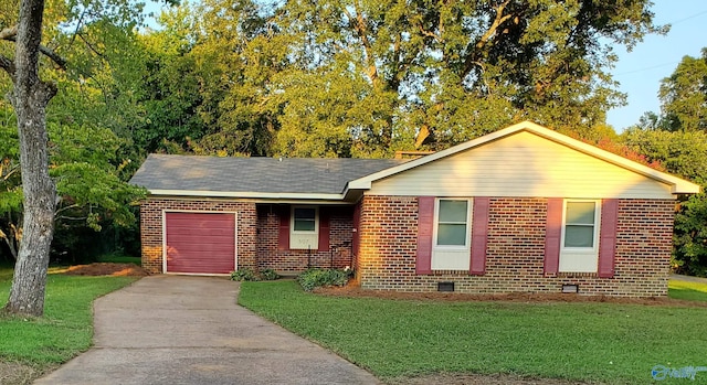 ranch-style house with a garage and a front yard