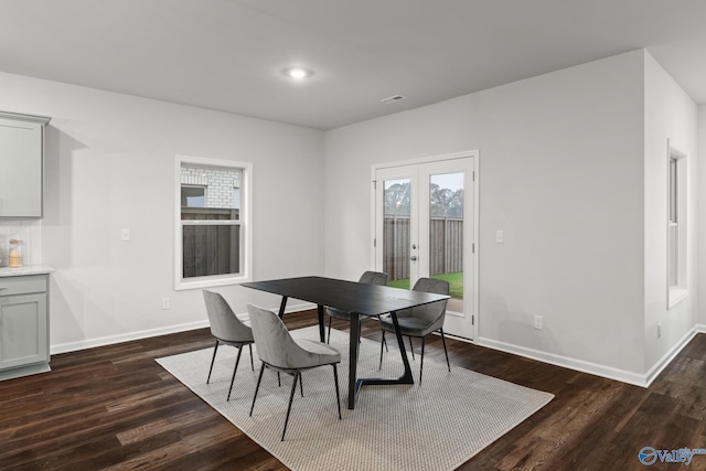 dining area with french doors and dark hardwood / wood-style floors