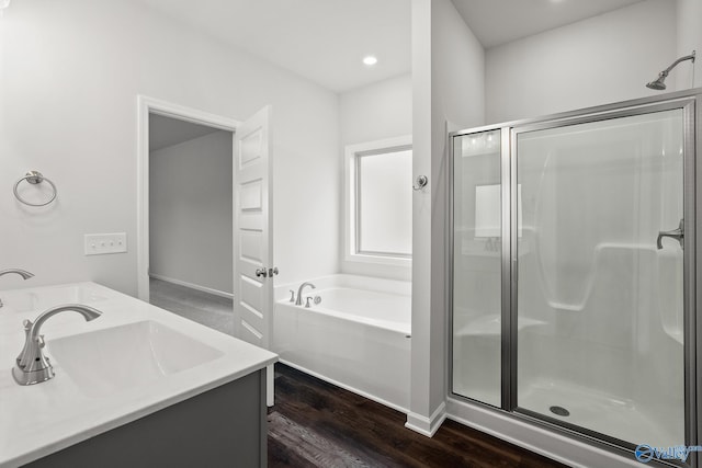 bathroom with vanity, separate shower and tub, and wood-type flooring