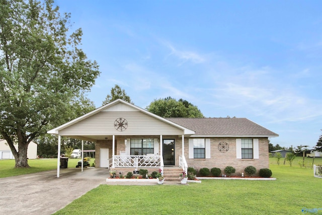 single story home featuring a porch, a carport, and a front lawn