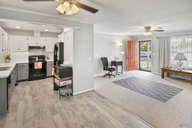 kitchen featuring light wood-type flooring, black appliances, exhaust hood, and ceiling fan