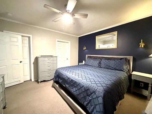 bedroom featuring a ceiling fan, ornamental molding, and carpet flooring