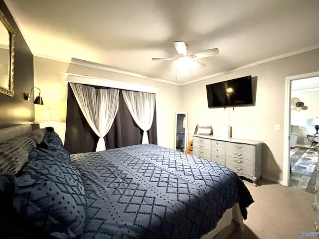 carpeted bedroom with a ceiling fan and crown molding