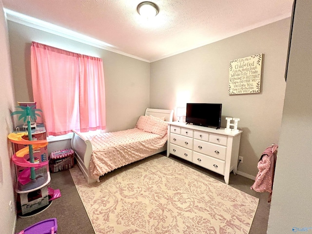 bedroom with carpet and a textured ceiling