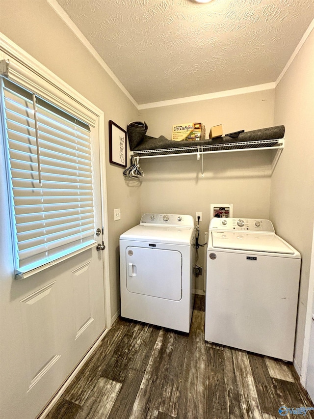 laundry area with a textured ceiling, laundry area, washer and clothes dryer, and dark wood-style flooring