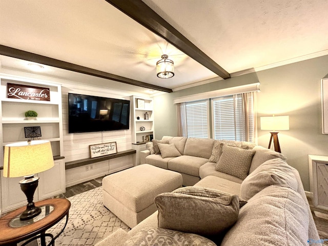 living room with beam ceiling, crown molding, and wood finished floors