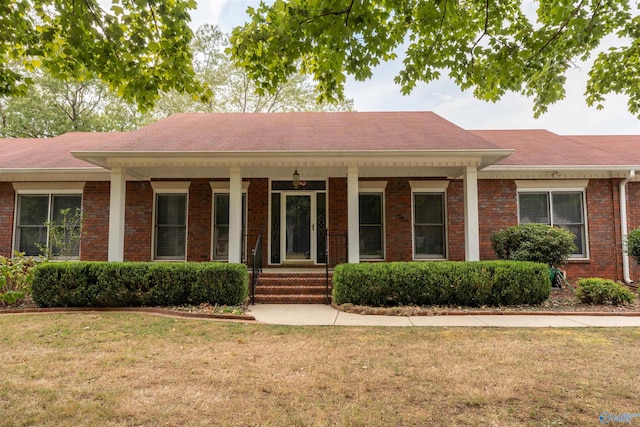 ranch-style house with a front lawn