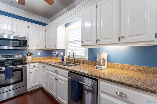 kitchen featuring ceiling fan, sink, white cabinetry, stainless steel appliances, and dark hardwood / wood-style floors