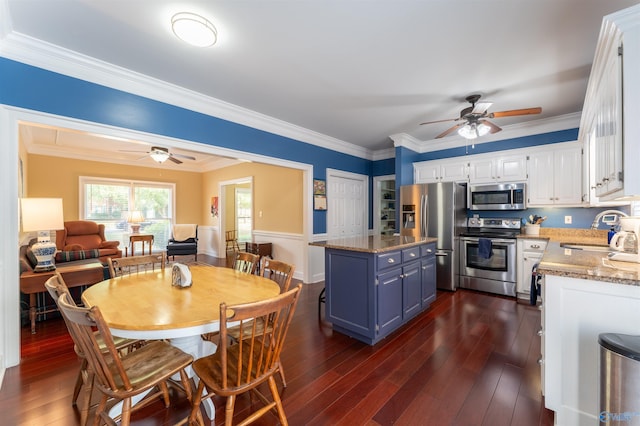 dining space featuring ornamental molding, ceiling fan, dark hardwood / wood-style floors, and sink