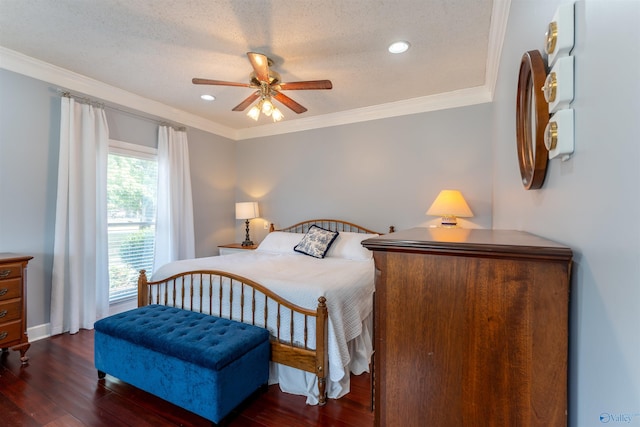 bedroom featuring ceiling fan, ornamental molding, a textured ceiling, and dark wood-type flooring