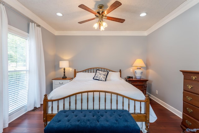 bedroom with ceiling fan, dark hardwood / wood-style floors, and crown molding